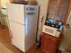 White refrigerator with microwave and spice rack nearby at 668 County Road 485, Lake Panasoffkee, FL 33538