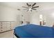 Bright bedroom with ceiling fan and en-suite bathroom at 707 Chinoy Rd, Davenport, FL 33837