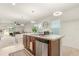 Kitchen island with granite countertop and stainless steel dishwasher at 707 Chinoy Rd, Davenport, FL 33837