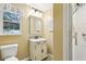 Clean bathroom with a vanity, shower, and toilet at 8202 Oak St, Yalaha, FL 34797