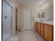 Bathroom with double vanity, shower, and separate toilet at 8633 Se 133Rd Ln, Summerfield, FL 34491