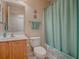 Clean bathroom with a tub shower, vanity, and light green accents at 8633 Se 133Rd Ln, Summerfield, FL 34491