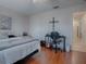 Spacious bedroom with built-in workspace and access to bathroom at 8633 Se 133Rd Ln, Summerfield, FL 34491