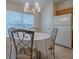 Bright dining area with round table and chairs by window at 8633 Se 133Rd Ln, Summerfield, FL 34491