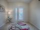 Bright entryway with a glass door and decorative rug at 8633 Se 133Rd Ln, Summerfield, FL 34491