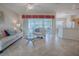 Living Room with light beige walls, tile floors and comfortable seating at 8633 Se 133Rd Ln, Summerfield, FL 34491