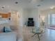 Living area with comfortable seating and views of kitchen and entry at 8633 Se 133Rd Ln, Summerfield, FL 34491