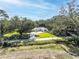 House nestled in a wooded area with a long driveway at 871 Cr 548, Bushnell, FL 33513