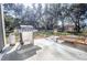Relaxing backyard patio with grill and seating area, perfect for outdoor entertaining at 871 Cr 548, Bushnell, FL 33513