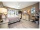 Bright bedroom with hardwood floors and large windows at 871 Cr 548, Bushnell, FL 33513