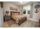 Cozy bedroom with wood-framed bed and soft bedding at 871 Cr 548, Bushnell, FL 33513