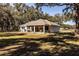Single story home with screened porch and large backyard at 871 Cr 548, Bushnell, FL 33513