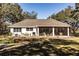 Single story home with screened porch and large backyard at 871 Cr 548, Bushnell, FL 33513