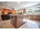 Kitchen island with seating, stainless steel appliances, and hardwood floors at 871 Cr 548, Bushnell, FL 33513