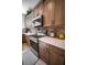 Modern kitchen with stainless steel appliances and light wood cabinets at 871 Cr 548, Bushnell, FL 33513