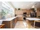 Modern kitchen with wood cabinets, quartz countertops, and a large sink at 871 Cr 548, Bushnell, FL 33513