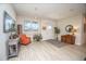 Bright and airy living room with wood-look floors and a cozy seating area at 871 Cr 548, Bushnell, FL 33513