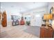 Light-filled entryway with wood-look floors, and a seating area at 871 Cr 548, Bushnell, FL 33513
