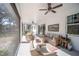 Cozy screened porch with wicker furniture, perfect for relaxing at 871 Cr 548, Bushnell, FL 33513