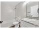 Modern bathroom with marble tile and updated vanity at 9139 Se 155Th Pl, Summerfield, FL 34491