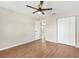 Light-filled bedroom with wood floors and a large closet at 9139 Se 155Th Pl, Summerfield, FL 34491
