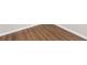 Close up of hardwood flooring and white trim at 9139 Se 155Th Pl, Summerfield, FL 34491