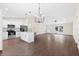 Open floor plan with island seating connects the kitchen to the living room, perfect for entertaining at 9139 Se 155Th Pl, Summerfield, FL 34491