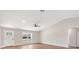 Bright living room with hardwood floors, a ceiling fan, and open kitchen at 9139 Se 155Th Pl, Summerfield, FL 34491