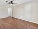 Spacious main bedroom boasts hardwood floors, a ceiling fan, and neutral wall color at 9139 Se 155Th Pl, Summerfield, FL 34491