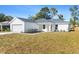 Modern farmhouse style home with white exterior and gray roof at 9167 Se 155Th Pl, Summerfield, FL 34491