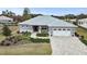 Single-Gathering home with three-car garage and manicured lawn at 9287 Sw 102Nd Avenue Rd, Ocala, FL 34481