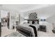 Main bedroom with large bed, walk-in closet, and ensuite bathroom at 9287 Sw 102Nd Avenue Rd, Ocala, FL 34481