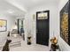 Bright and spacious entryway with a statement black door at 9287 Sw 102Nd Avenue Rd, Ocala, FL 34481