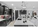 Modern kitchen with dark cabinetry and a large island at 9287 Sw 102Nd Avenue Rd, Ocala, FL 34481