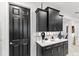 Stylish kitchen with dark cabinetry, quartz countertops, and built-in storage at 9287 Sw 102Nd Avenue Rd, Ocala, FL 34481