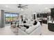Open concept living room and kitchen with large sectional sofa at 9287 Sw 102Nd Avenue Rd, Ocala, FL 34481