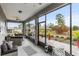 Relaxing screened porch with seating and a view of the backyard at 9287 Sw 102Nd Avenue Rd, Ocala, FL 34481