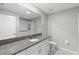 Bright bathroom featuring a large vanity with granite countertops at 9334 Sw 57Th Ave, Ocala, FL 34476
