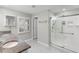Modern bathroom with granite countertops and a walk-in shower at 9334 Sw 57Th Ave, Ocala, FL 34476