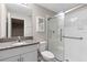 Well-lit bathroom with glass shower door, granite countertop, and modern fixtures at 9334 Sw 57Th Ave, Ocala, FL 34476