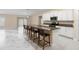 Modern kitchen features a spacious island with seating and stainless steel appliances at 9334 Sw 57Th Ave, Ocala, FL 34476