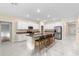 Open kitchen featuring stainless steel appliances, granite countertops, and island seating at 9334 Sw 57Th Ave, Ocala, FL 34476