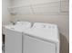 Laundry room with washer, dryer, and shelving at 9334 Sw 57Th Ave, Ocala, FL 34476