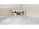 Open-concept space with kitchen, dining, and living areas, featuring marble flooring at 9334 Sw 57Th Ave, Ocala, FL 34476