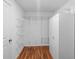 Walk-in closet featuring wood floors and wire shelving and cabinets at 9334 Sw 57Th Ave, Ocala, FL 34476