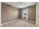 Bedroom with ceiling fan and neutral colored walls at 961 Lido Dr, Howey In The Hills, FL 34737