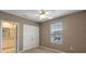 Bedroom with ceiling fan and double door closet at 961 Lido Dr, Howey In The Hills, FL 34737