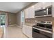 Stainless steel appliances and granite countertops in kitchen at 961 Lido Dr, Howey In The Hills, FL 34737