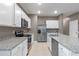 Modern kitchen with stainless steel appliances and granite countertops at 961 Lido Dr, Howey In The Hills, FL 34737