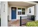 Modern townhome's front entry with blue door and black railing at 9790 Amber Chestnut Way, Winter Garden, FL 34787